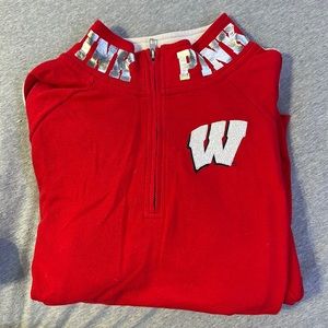Pink University of Wisconsin–Madison, Wisconsin Badgers quarter zip sweater.